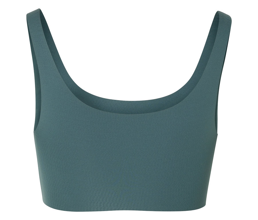 Gros plan d'un soutien-gorge de sport vert.