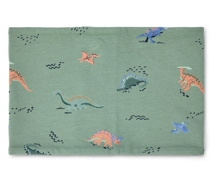 Un cache-cou vert clair avec des motifs de dinosaures et de vagues est posé sur un fond blanc.