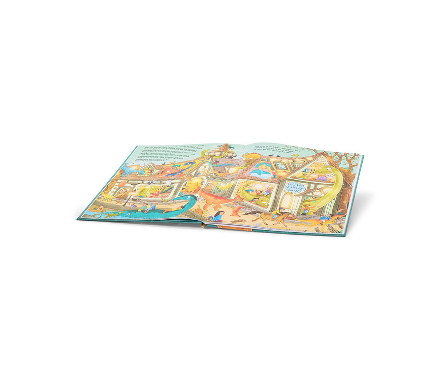 Livre pour enfants ouvert avec une illustration colorée d'un bâtiment à plusieurs étages, étiqueté « KITA KUNTERBUNT », où jouent enfants et dinosaures.