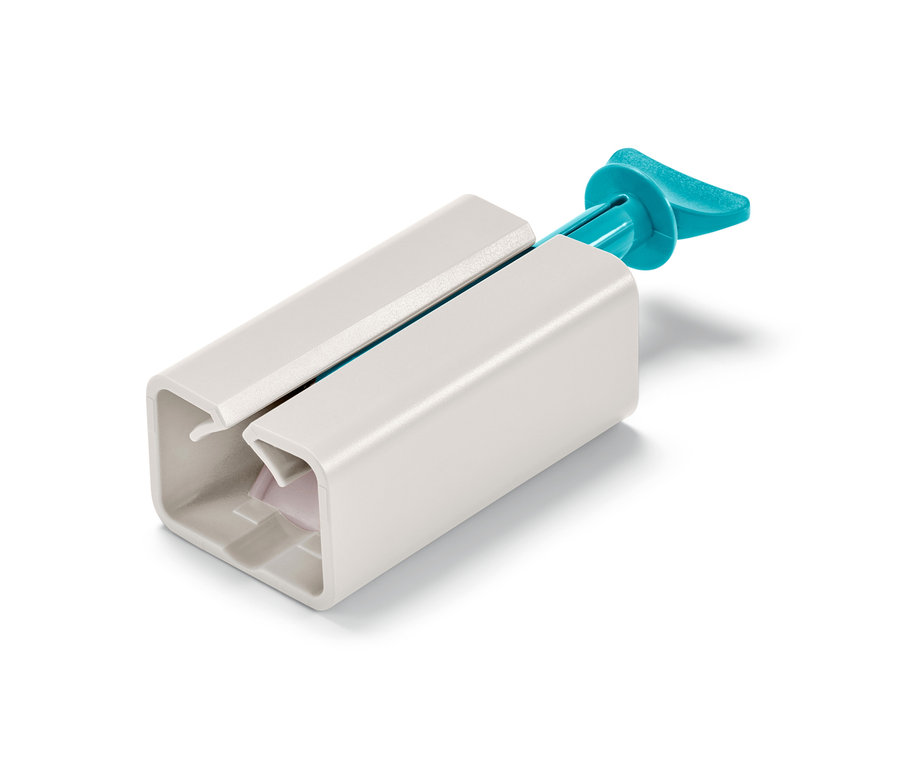 Presseur de tubes blanc avec poignée bleue.