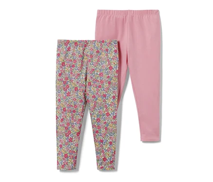 Deux leggings pour bébé : un avec un motif floral et un rose.