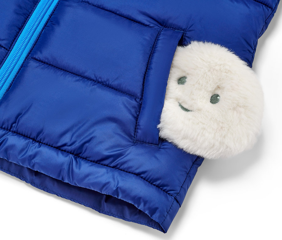 Veste bleue avec 2 coussins chauffants de poche.