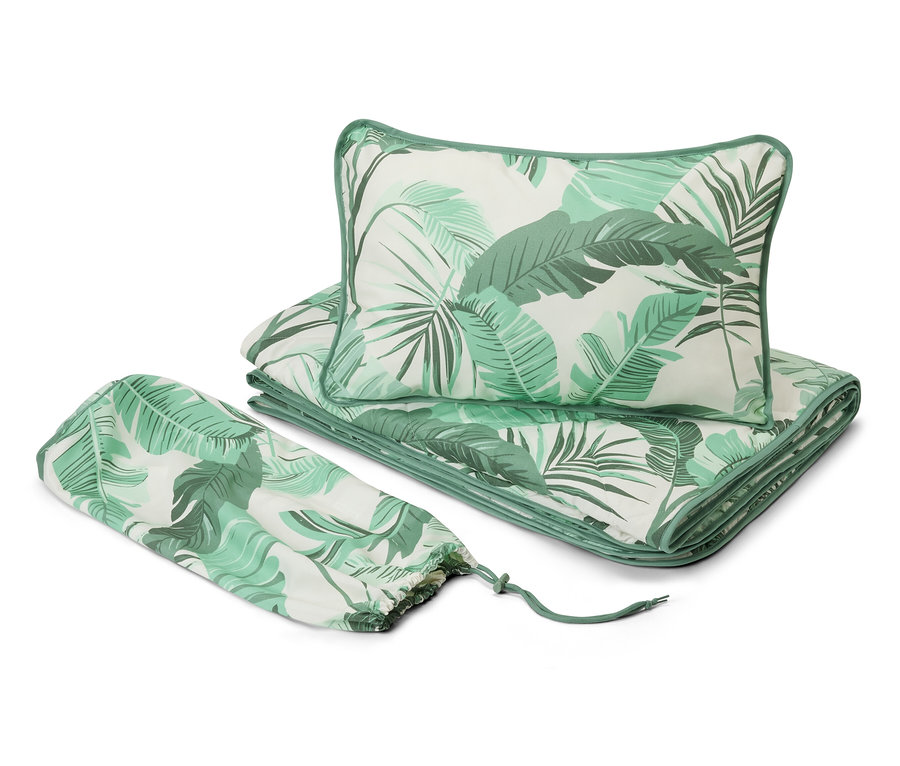 Kit de literie de voyage avec motif de feuilles tropicales.