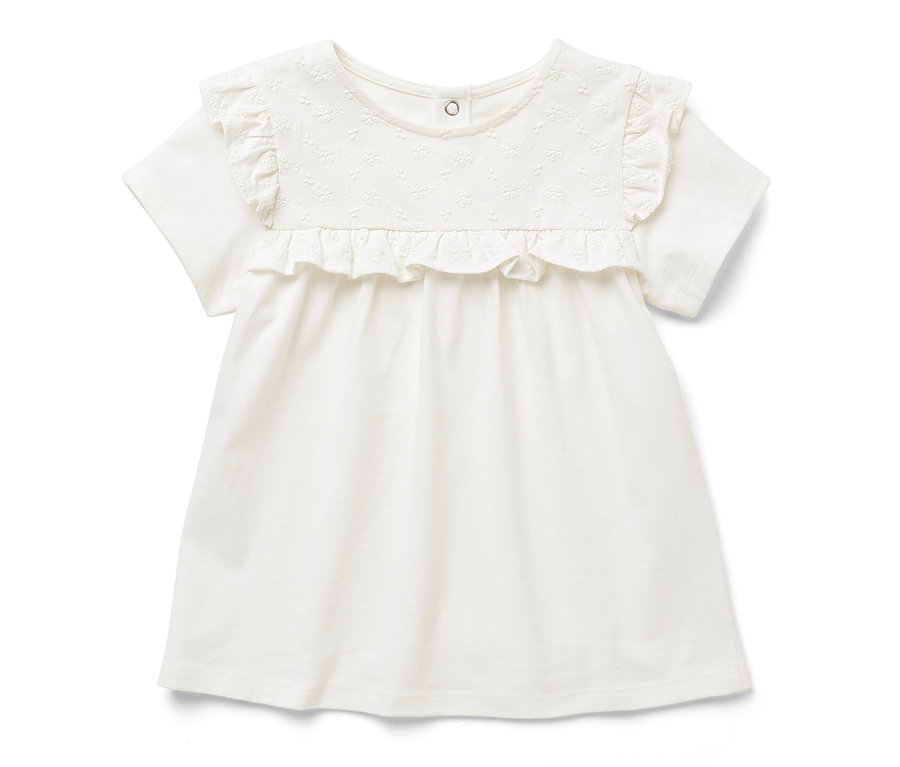 T-shirt blanc pour enfant avec des manches courtes et des volants.