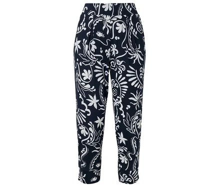 Un pantalon bleu marine avec un motif floral blanc.