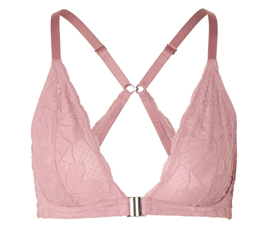 Gros plan d'un soutien-gorge rose en dentelle avec des bretelles croisées.