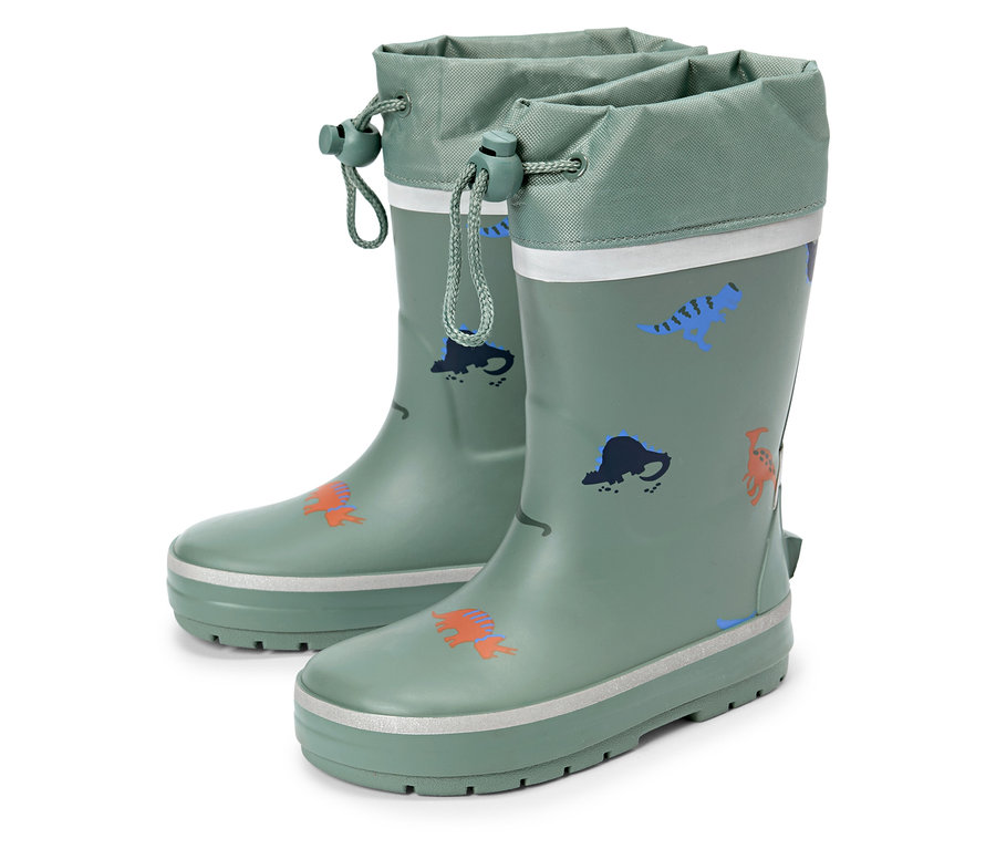 Paire de bottes de pluie vertes avec motifs de dinosaures et cordon de serrage en haut.