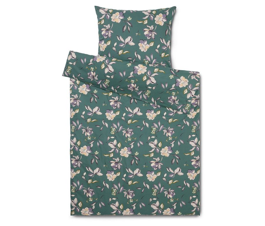 Ensemble de literie à motif floral sur fond vert, comprenant une taie d'oreiller et une housse de couette.
