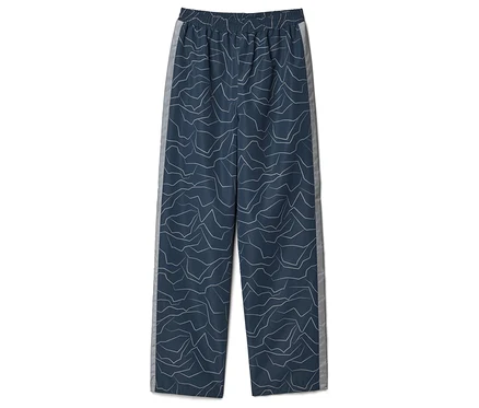 Un pantalon bleu avec motif blanc et bande latérale grise à plat.