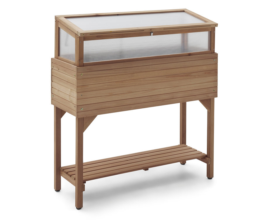 Un châssis de culture en bois avec un couvercle transparent et une étagère de rangement se trouve sur un fond blanc.