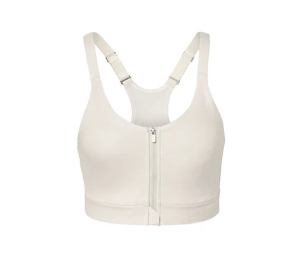 Soutien-gorge de sport crème avec une fermeture éclair au milieu.