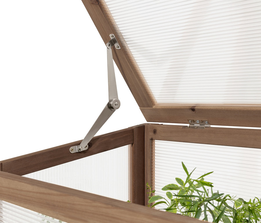 Vue détaillée d'une jardinière surélevée avec serre châssis « Elin » dont le couvercle est partiellement ouvert.