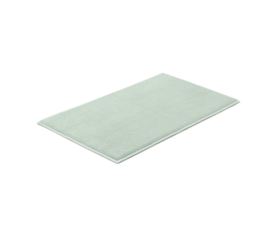 Un tapis de bain confortable vert clair, 40 x 70 cm, sur fond blanc.