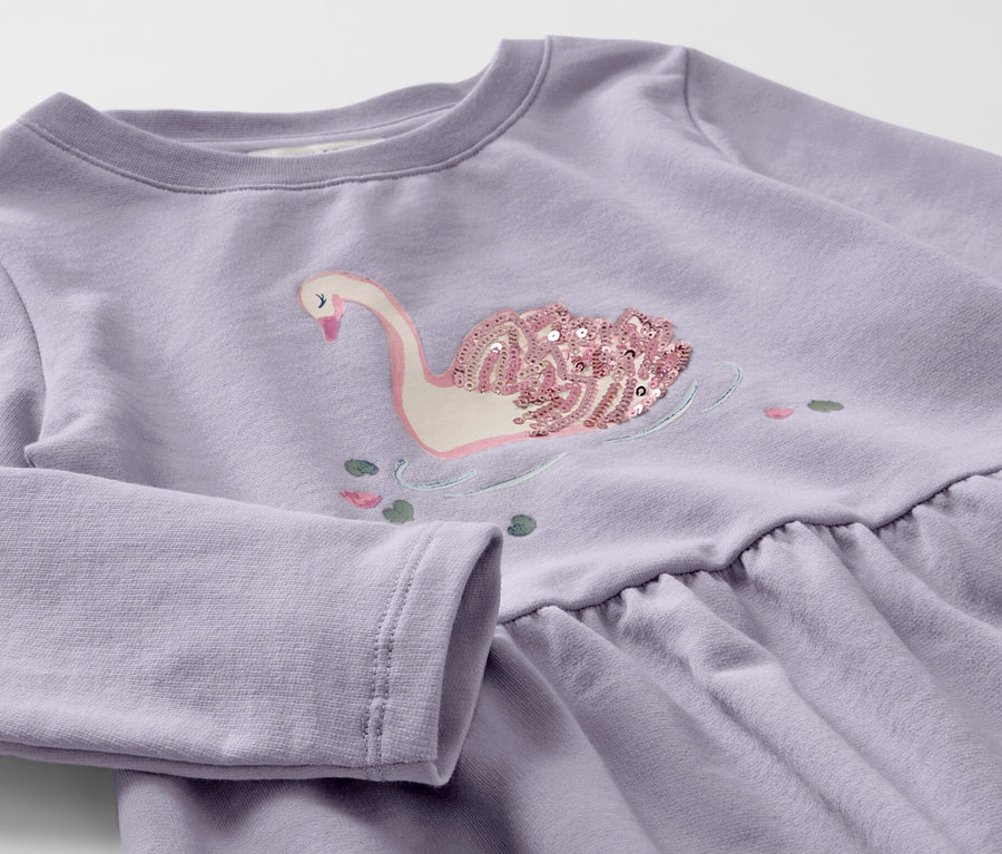 Robe en sweat violette pour enfant avec un cygne en sequins.