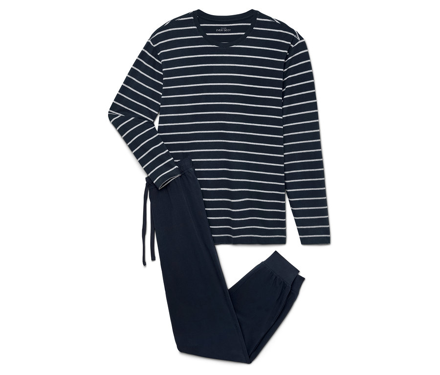 Pyjama bleu marine plié avec des rayures blanches, comprenant un haut à manches longues et un pantalon.