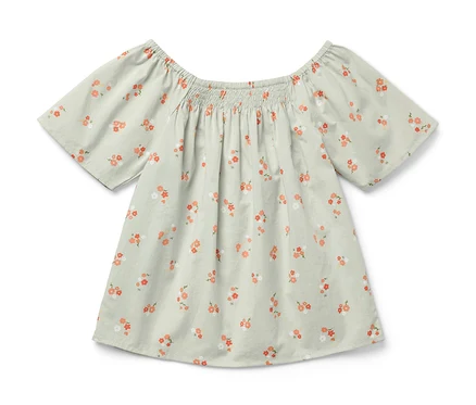 Blouse pour enfant vert clair à manches courtes et imprimé floral.