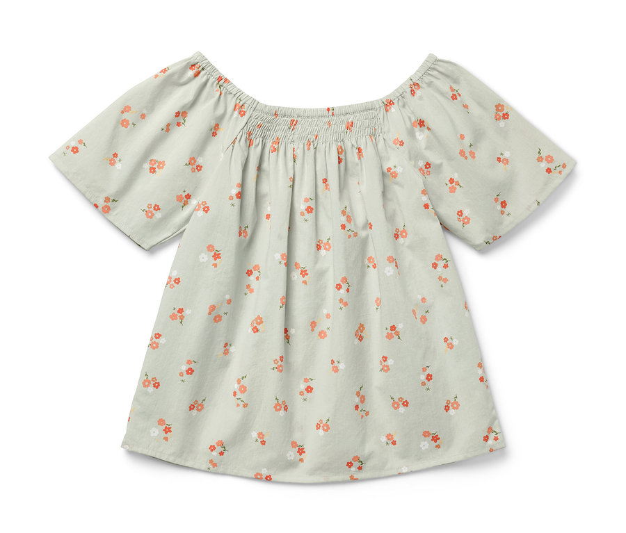 Blouse pour enfant vert clair à manches courtes et imprimé floral.