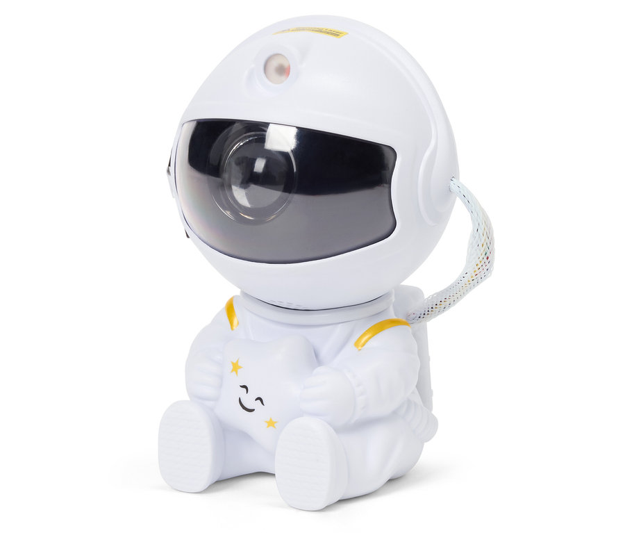 Un astronaute en costume blanc est assis et tient une étoile.