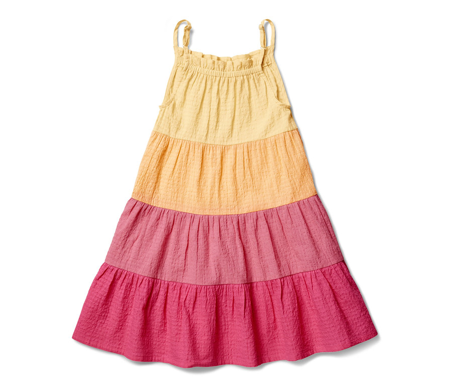 Une robe tissée multicolore pour enfant avec des bretelles.