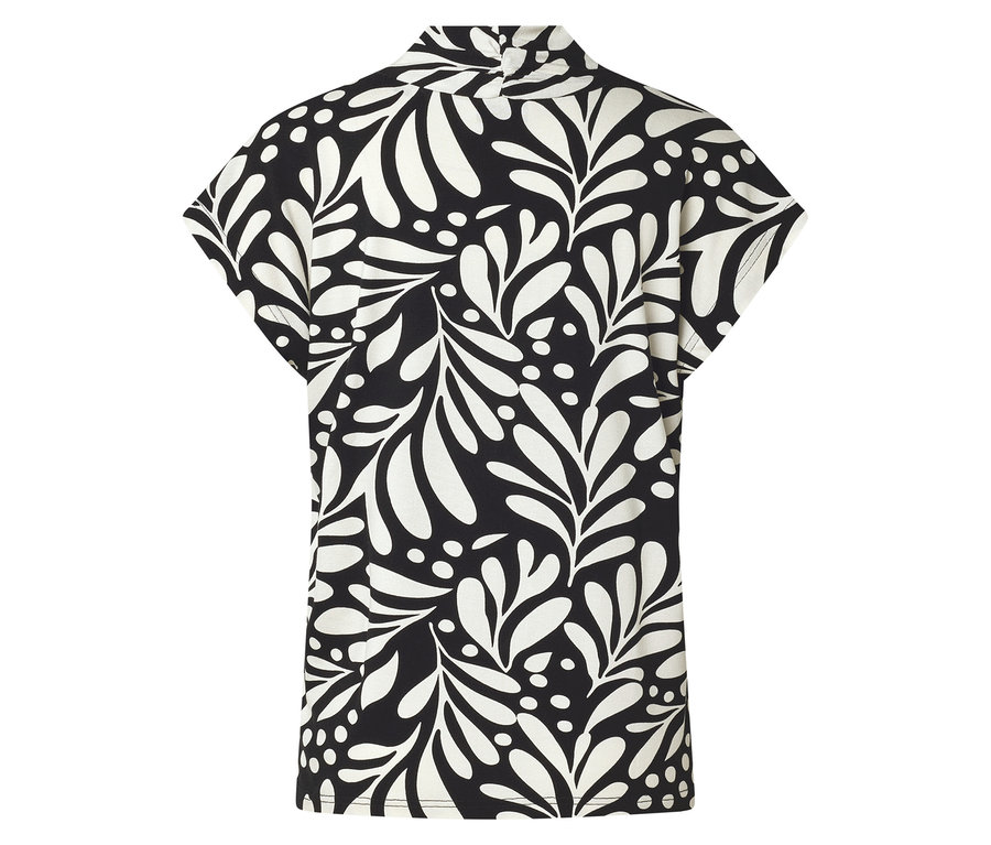 Vue arrière d'un haut noir et blanc avec un motif de feuilles et de points.