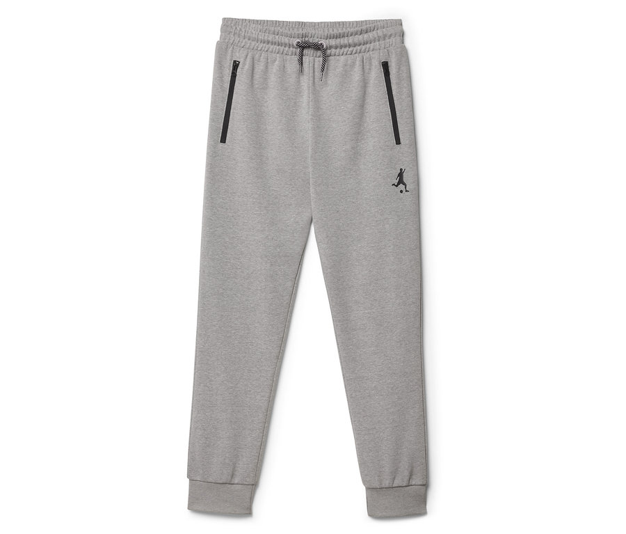 Pantalon de jogging gris avec cordon de serrage et poches zippées.