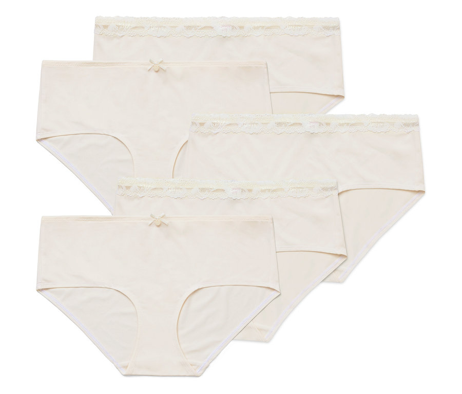 Cinq culottes beiges claires pour femmes sont posées les unes sur les autres.