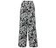 Pantalon noir avec motifs de feuilles et de points blancs.