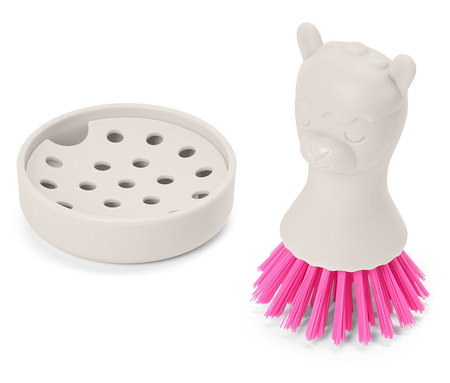 Un égouttoir beige est placé à côté d'une brosse beige avec un manche en forme de lama et des poils roses.
