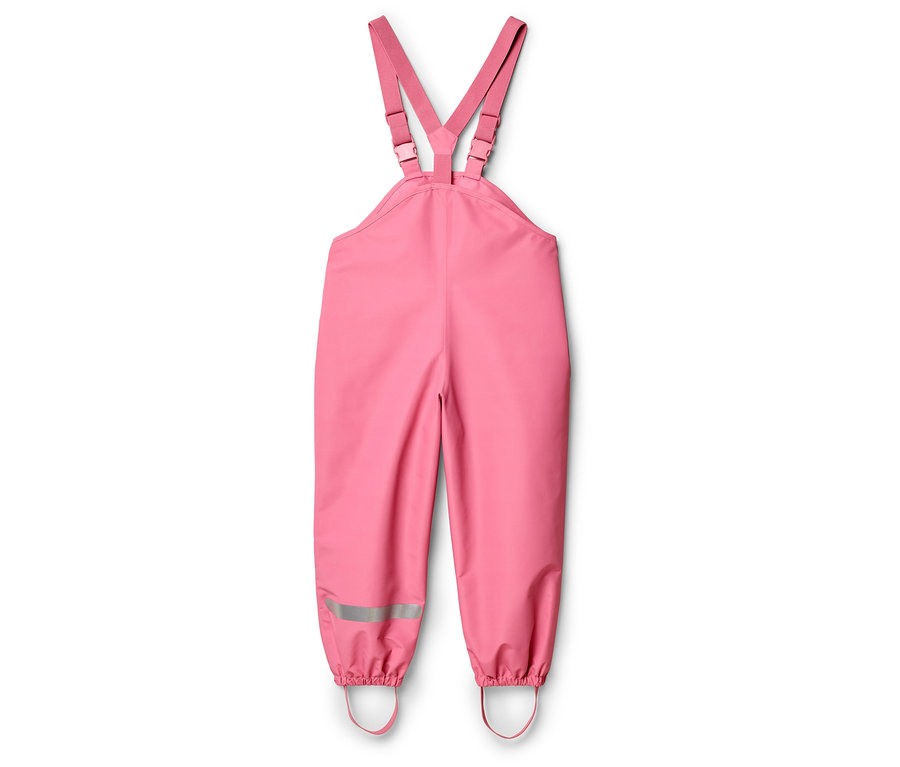 Pantalon de pluie rose avec bretelles réglables et bandes réfléchissantes sur les jambes.