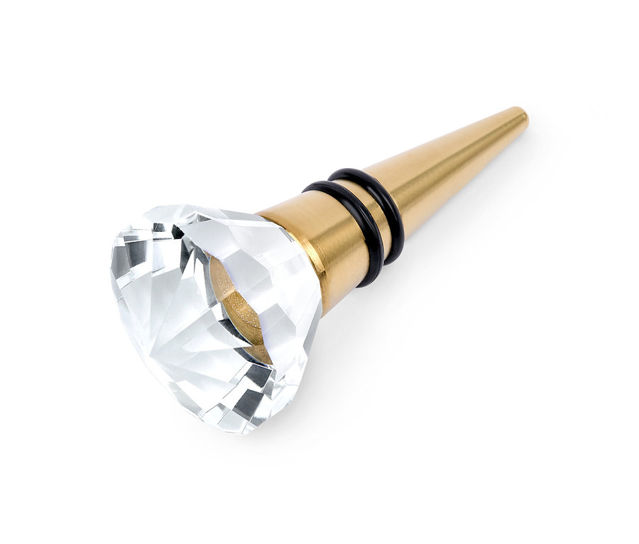 Bouchon de bouteille doré avec ornement en cristal.