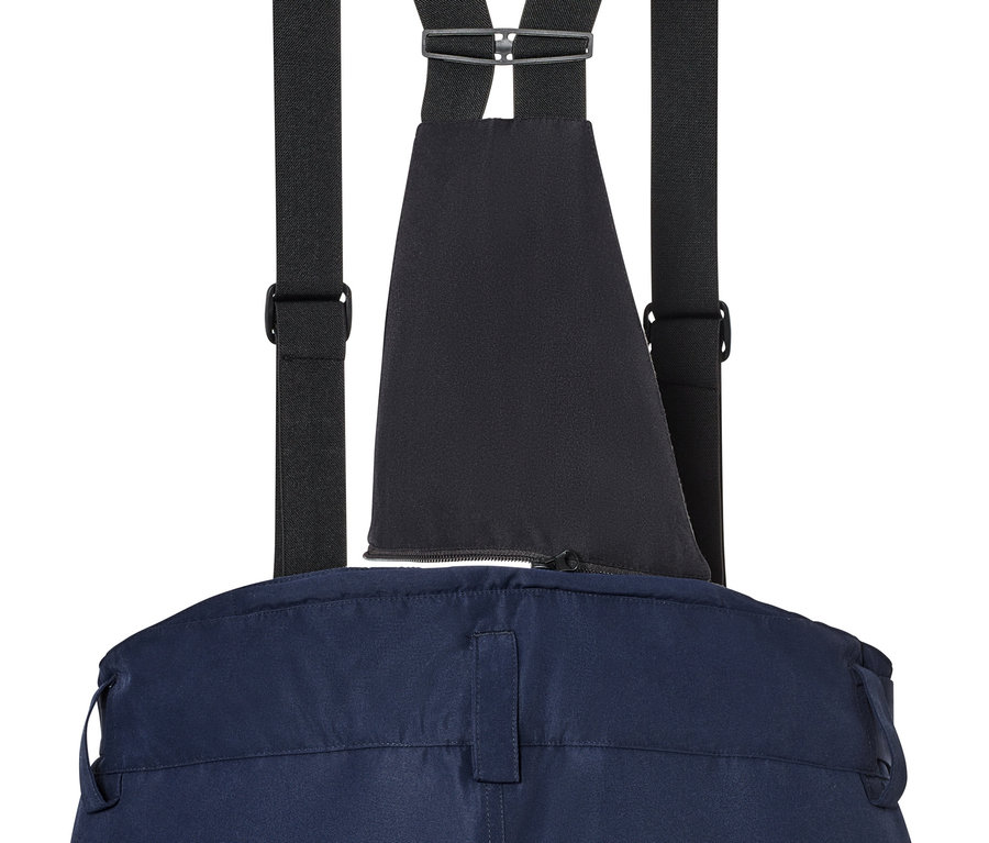 Détail d'un pantalon de ski bleu avec des bretelles noires.