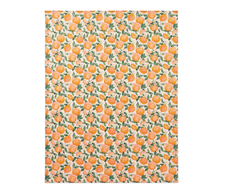 Nappe lavable avec motif d'oranges et de feuilles.