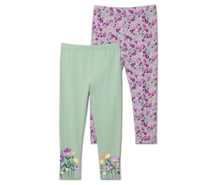 Deux leggings : un vert clair avec des fleurs en bas, l'autre violet avec un motif floral sur toute la surface.