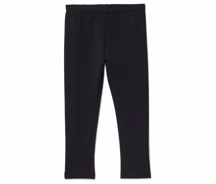 Un legging noir à taille élastique posé sur un fond blanc.