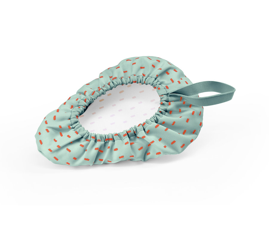 Housse de selle de vélo pour enfants avec des rectangles orange sur un fond vert.