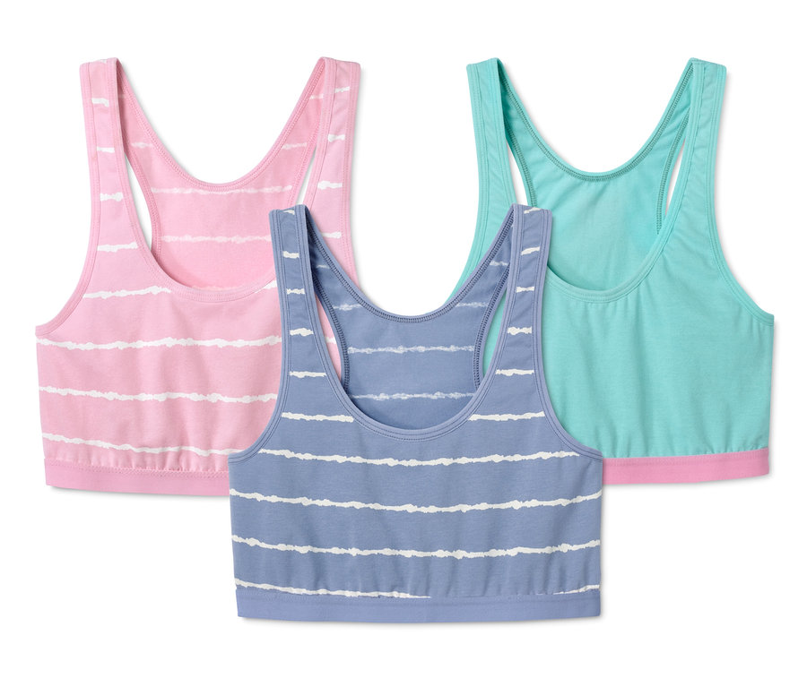 Trois brassières rayées en coton rose, bleu et turquoise.