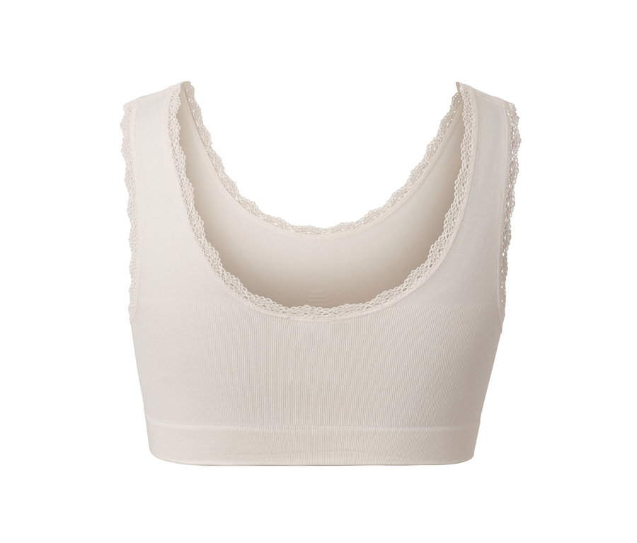 Une brassière seamless crème avec bordure en dentelle.