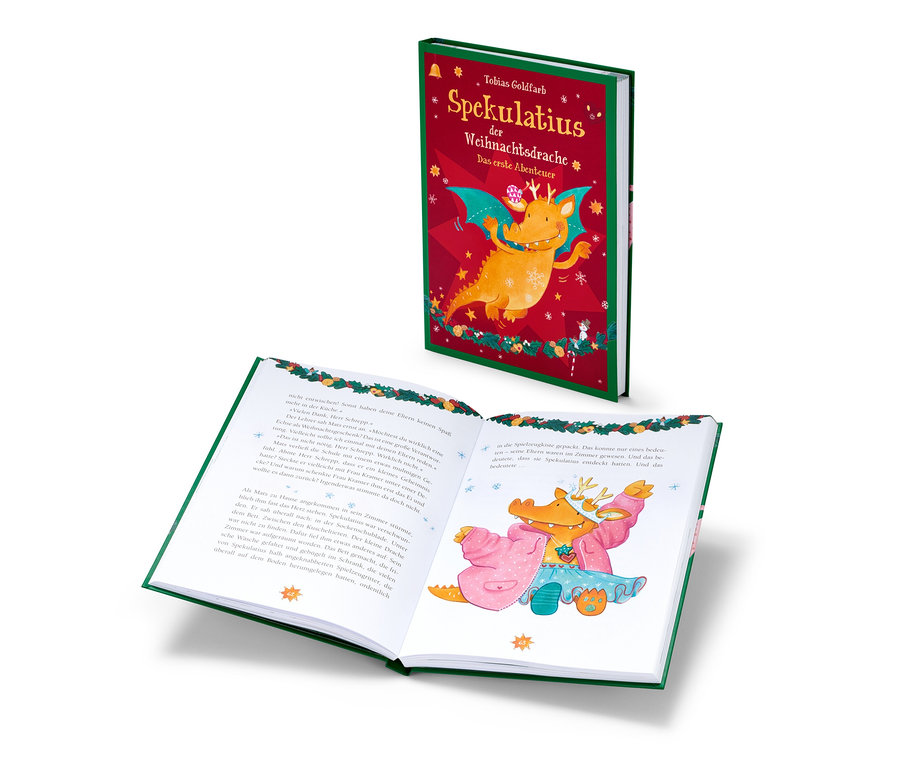 Le livre « Spekulatius, le dragon de Noël » est ouvert et montre une illustration d'un dragon en peignoir rose.