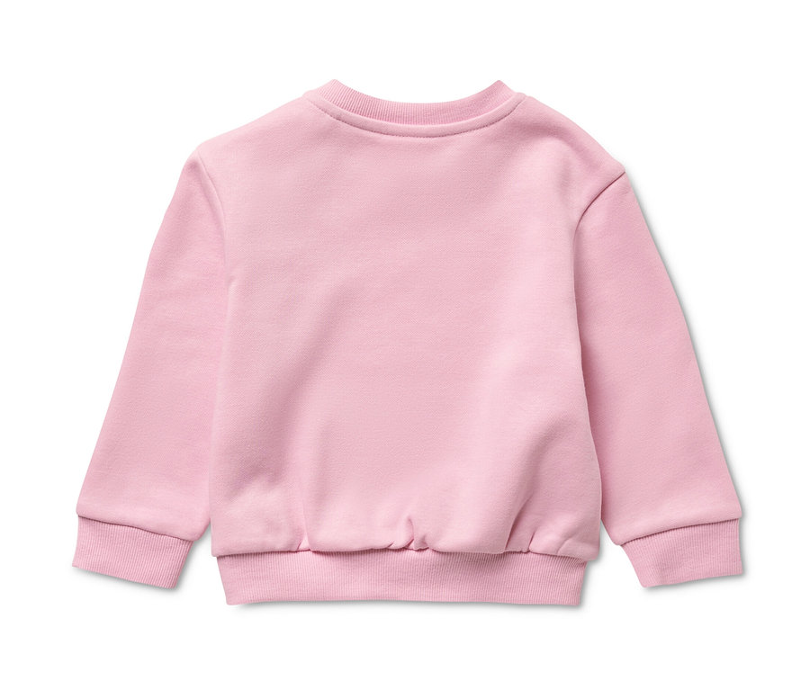Un sweatshirt rose pour enfant avec intérieur gratté, posé sur un fond blanc.