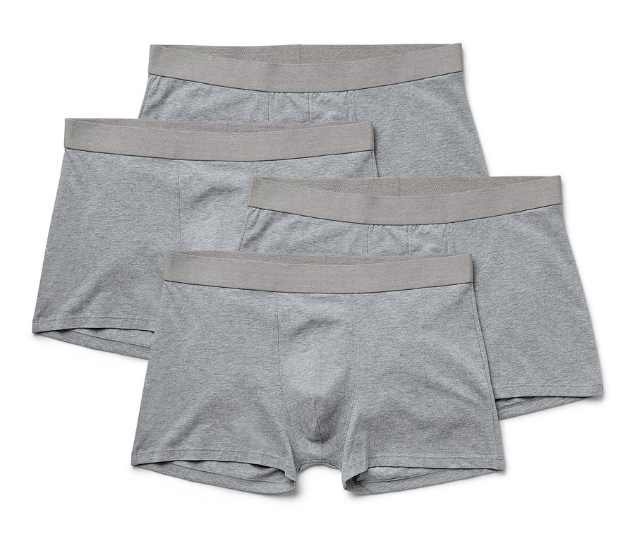 Quatre boxers gris, lot de 4, sont empilés les uns sur les autres.