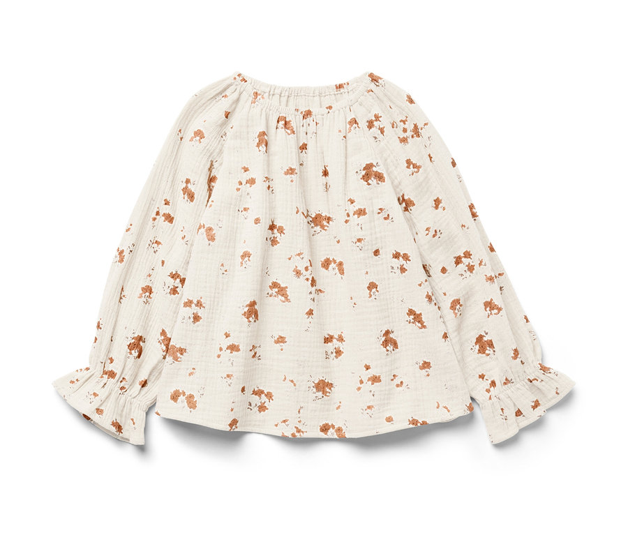 Une blouse en mousseline pour enfant à manches longues avec un imprimé floral marron.