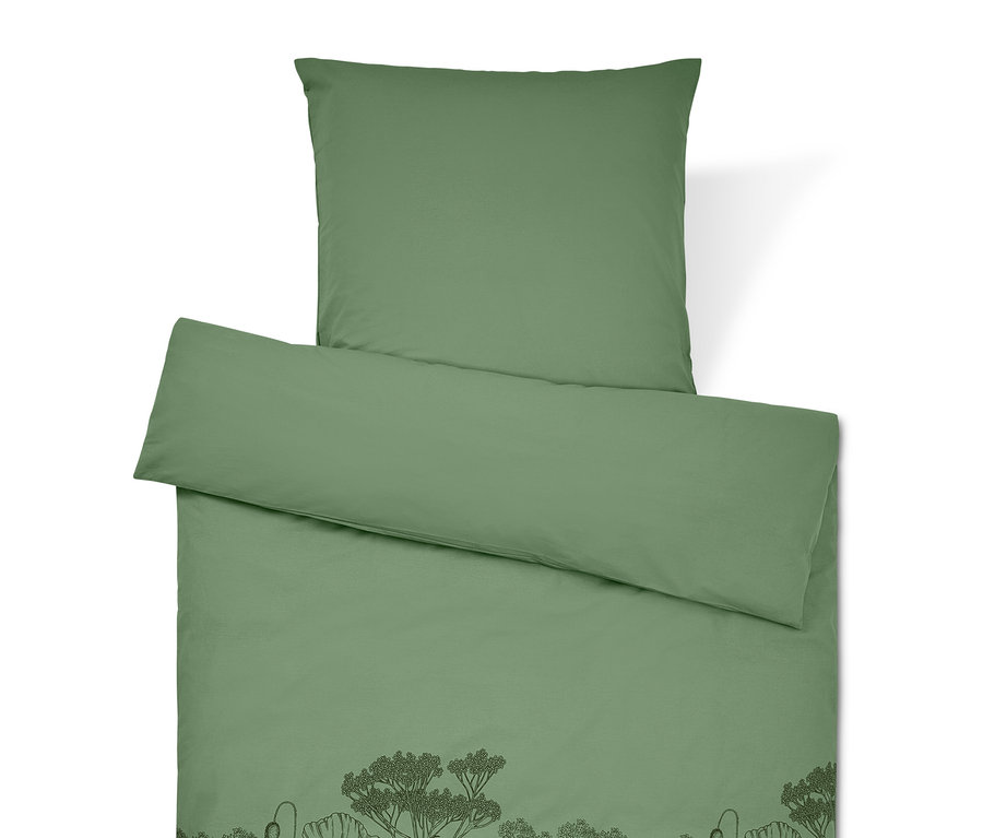 Linge de lit vert avec motif floral.