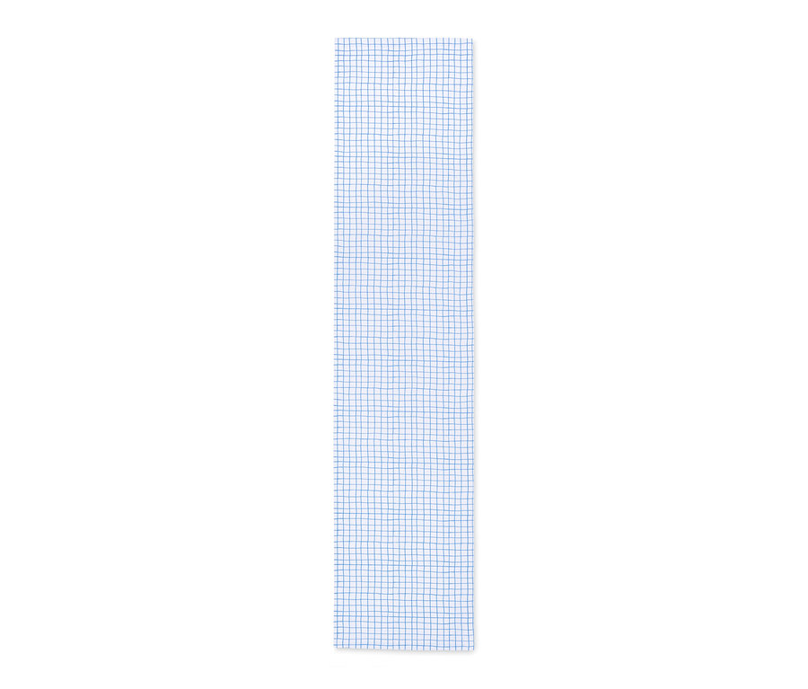 Un chemin de table à carreaux bleus, imprimé intégral.