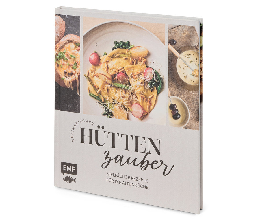 Gros plan d'un livre de cuisine intitulé Hüttenzauber avec des photos de plats.