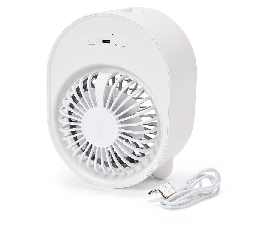 Un mini ventilateur blanc et rond est posé à côté d'un câble USB.