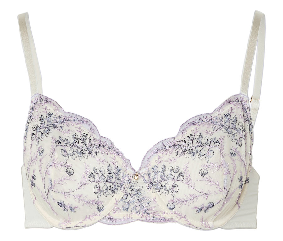 Un soutien-gorge blanc avec un motif floral violet et des bretelles blanches repose sur un fond blanc.