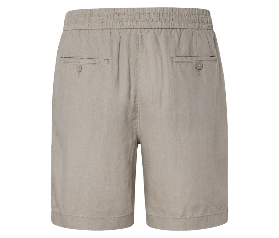 Gros plan sur l'arrière d'un short beige avec une ceinture élastique et deux poches plaquées.