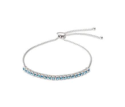 Bracelet argenté avec pierres bleu clair et fermoir réglable.