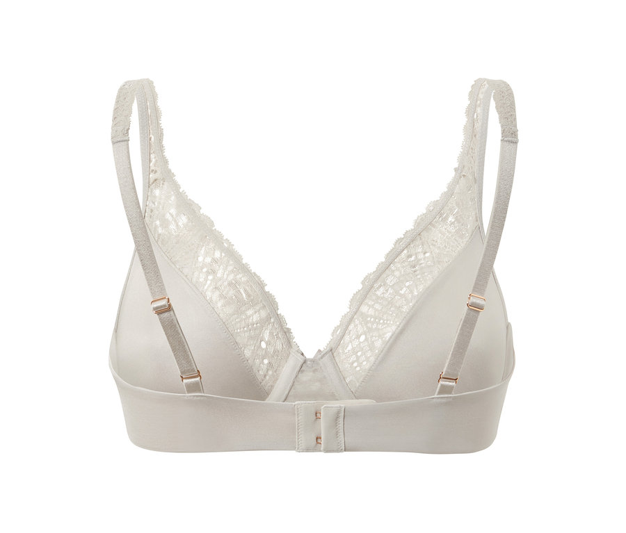 Détail d'un soutien-gorge à armatures grège avec de la dentelle.