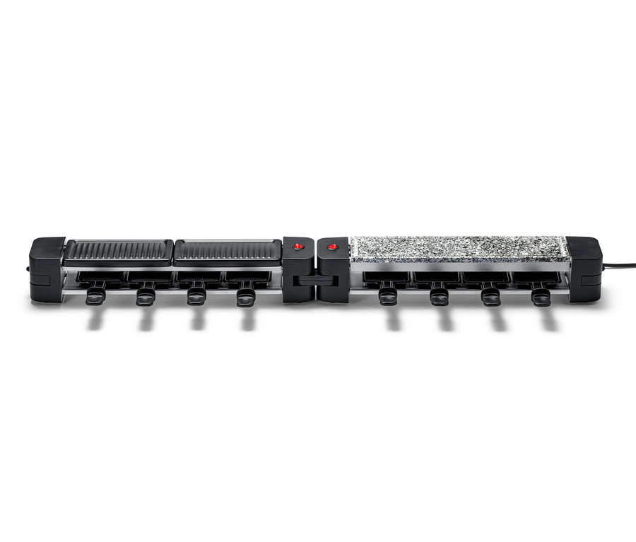 Un appareil à raclette pliable avec un cadre noir et une surface de cuisson grise.